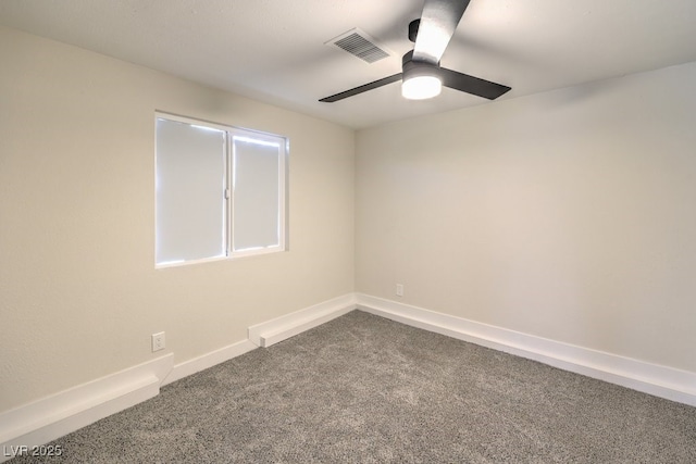 spare room featuring ceiling fan and carpet flooring