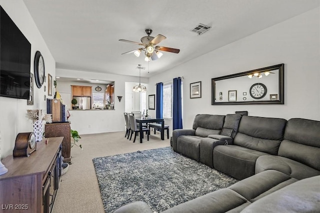 carpeted living room featuring ceiling fan