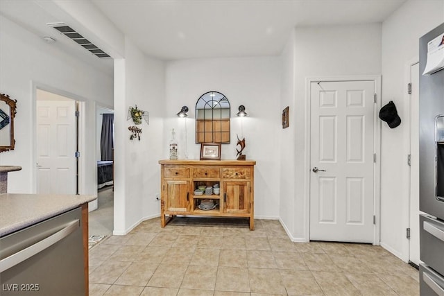 interior space with light tile patterned floors