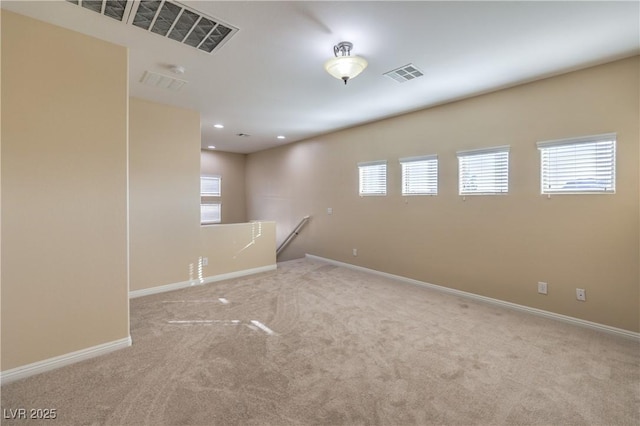 unfurnished room with light colored carpet