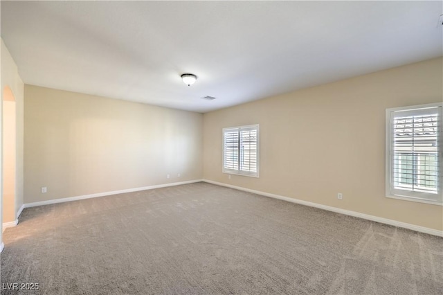 unfurnished room featuring carpet floors