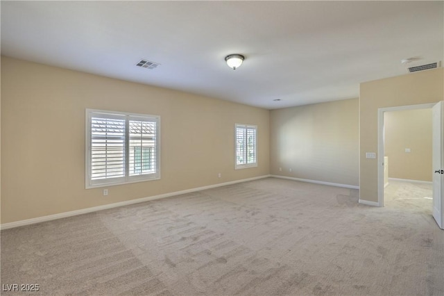 empty room featuring light colored carpet