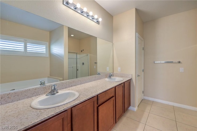 bathroom with plus walk in shower, vanity, and tile patterned flooring