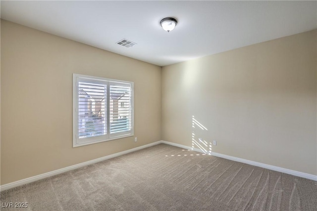 empty room featuring light colored carpet