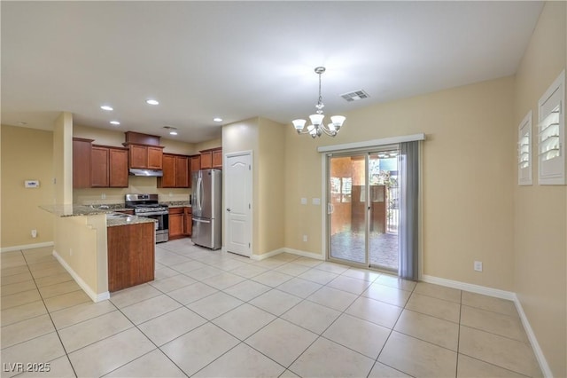 kitchen with kitchen peninsula, hanging light fixtures, appliances with stainless steel finishes, light tile patterned floors, and a notable chandelier