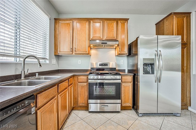 kitchen featuring light tile patterned flooring, appliances with stainless steel finishes, sink, and plenty of natural light