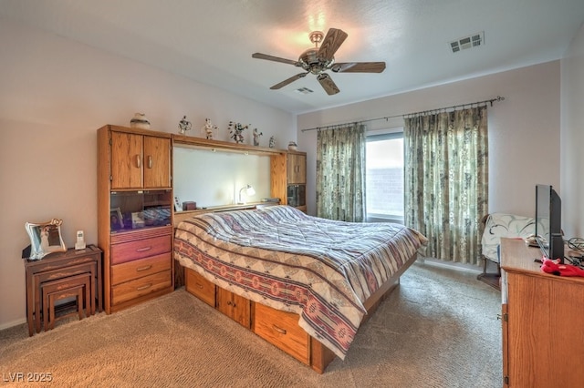 bedroom with ceiling fan and light carpet