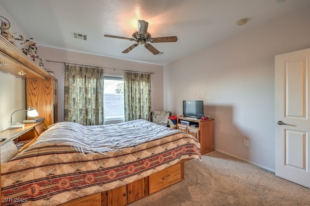 bedroom with ceiling fan and light colored carpet