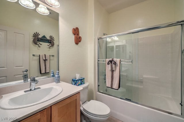 full bathroom featuring bath / shower combo with glass door, toilet, and vanity