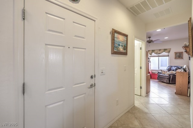 corridor with light tile patterned floors