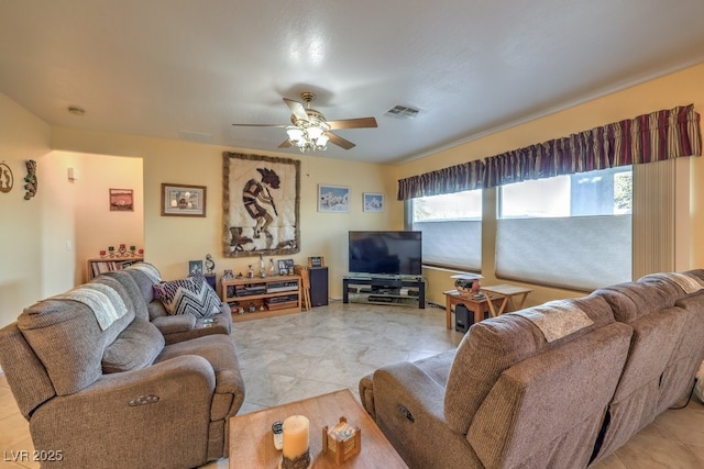 living room featuring ceiling fan and light tile patterned floors