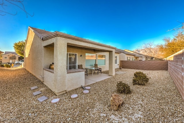 back of house featuring a patio area