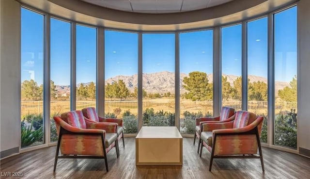 sunroom / solarium with a mountain view and a healthy amount of sunlight