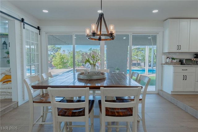 dining area featuring a notable chandelier