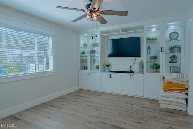 unfurnished living room with light hardwood / wood-style floors and ceiling fan