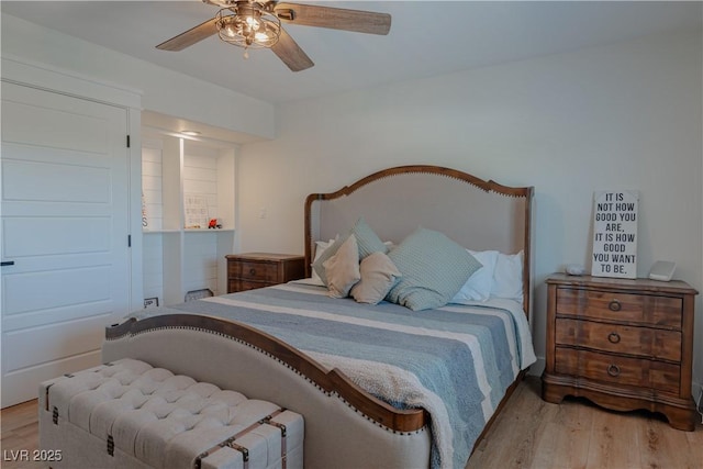 bedroom with ceiling fan and light wood-type flooring