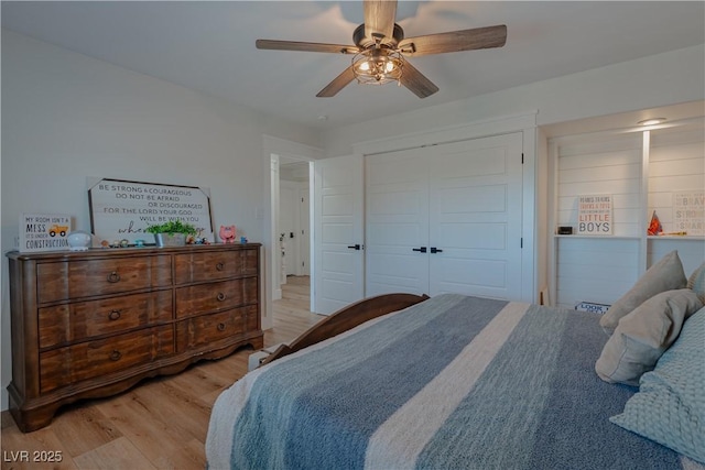 bedroom featuring a closet, ceiling fan, and light hardwood / wood-style flooring