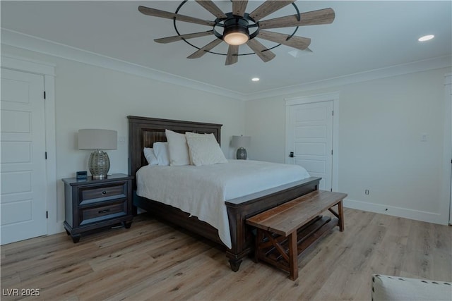 bedroom featuring ceiling fan, crown molding, and light hardwood / wood-style floors