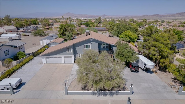 birds eye view of property featuring a mountain view