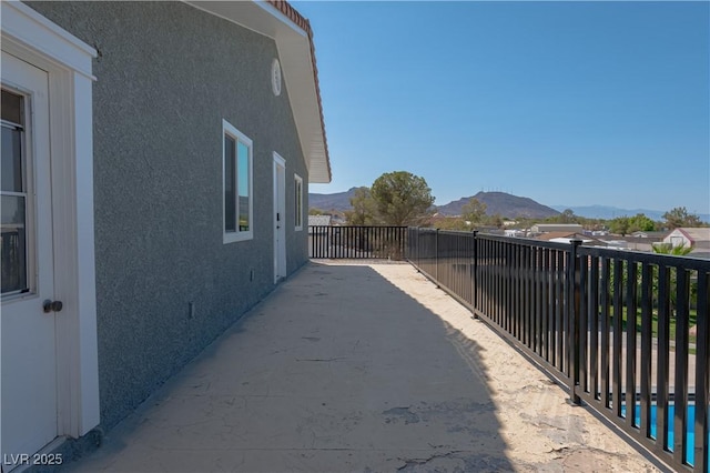 view of property exterior featuring a mountain view