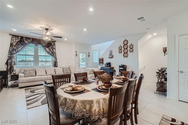 tiled dining room featuring ceiling fan