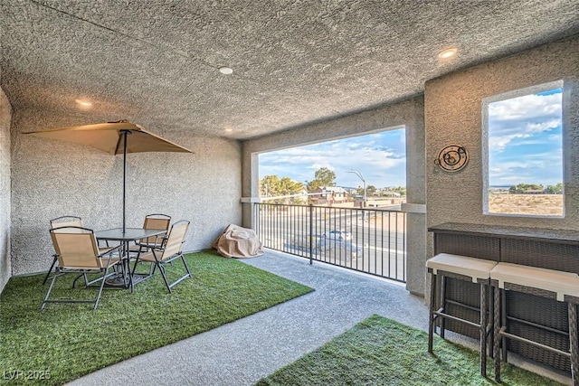 interior space with a balcony