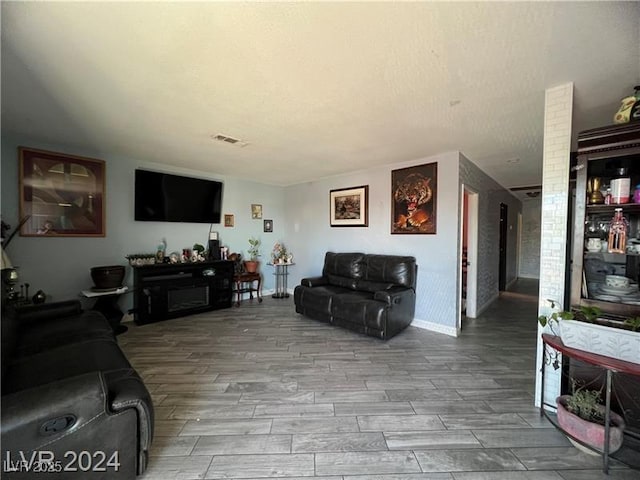 living room with wood-type flooring