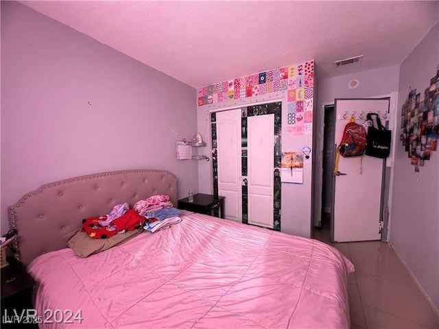 bedroom featuring tile patterned flooring