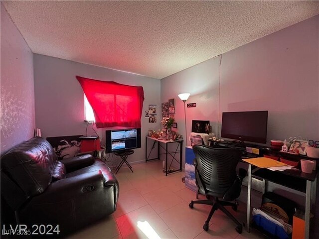 office area with a textured ceiling