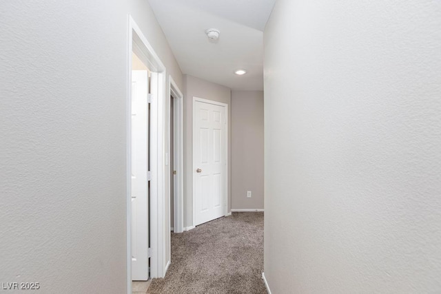 corridor with baseboards, carpet flooring, and recessed lighting