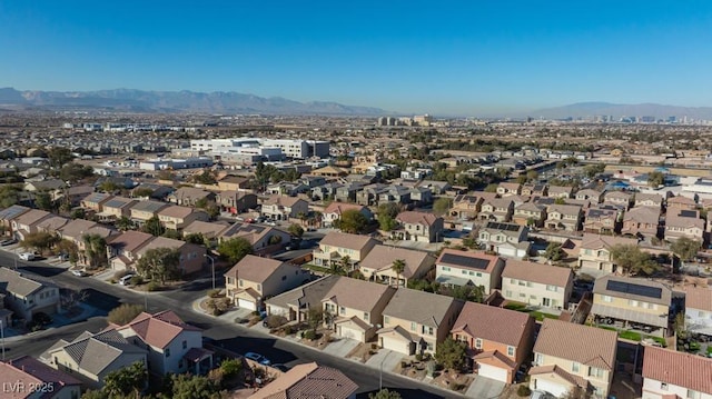 drone / aerial view with a residential view and a mountain view