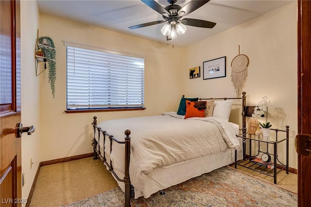 bedroom featuring light colored carpet and ceiling fan