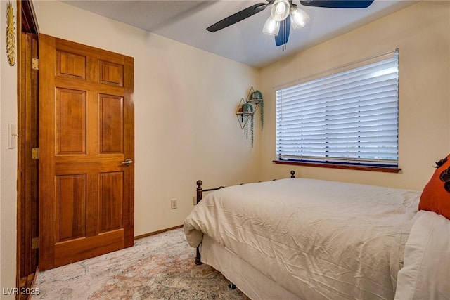 bedroom with ceiling fan and carpet