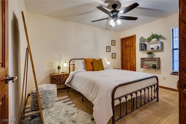 carpeted bedroom featuring ceiling fan