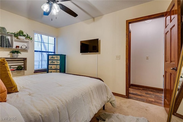 bedroom featuring ceiling fan and carpet