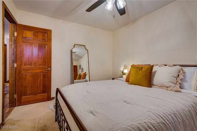 bedroom featuring light carpet and ceiling fan