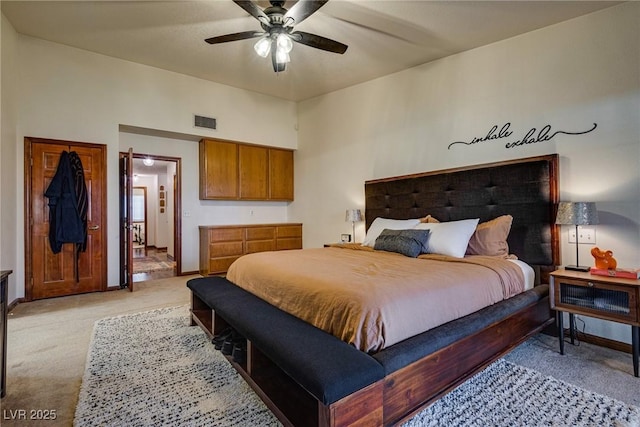 carpeted bedroom with ceiling fan