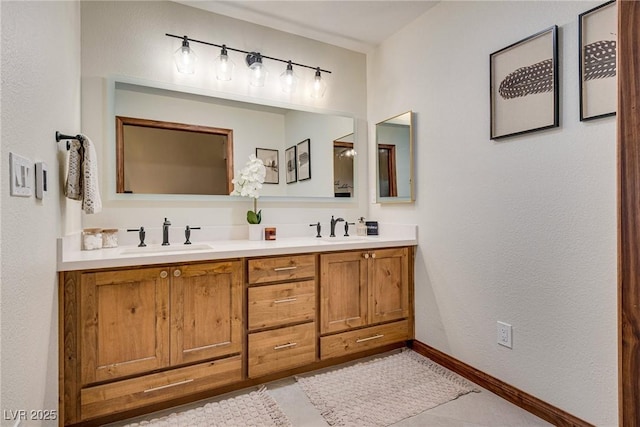 bathroom featuring tile patterned flooring and vanity