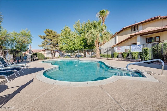 view of swimming pool with a patio area