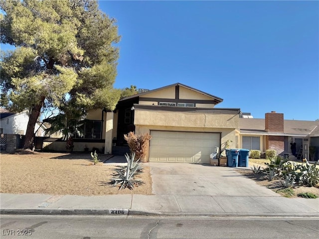 view of front of property with a garage