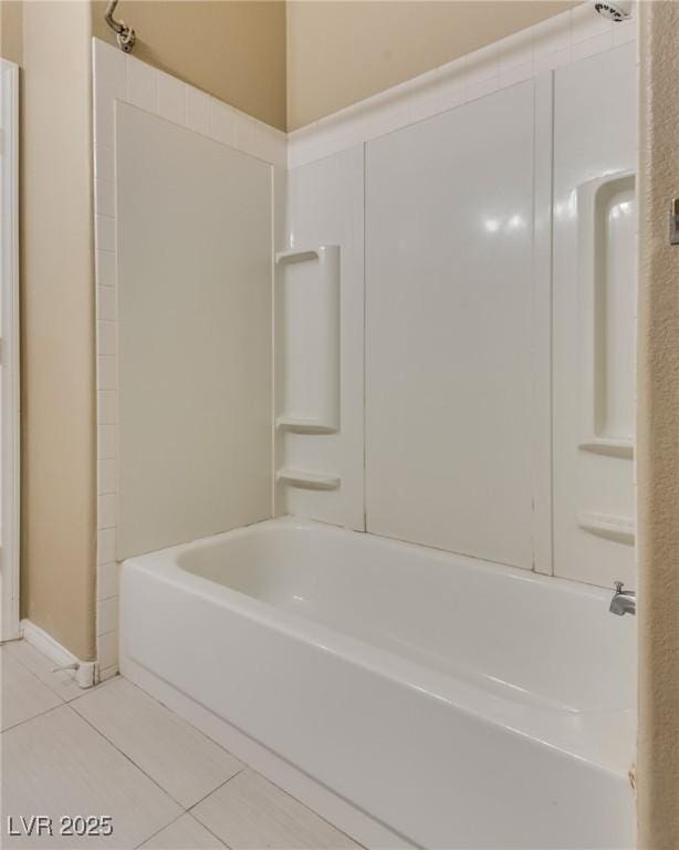 bathroom featuring shower / bath combination and tile patterned flooring