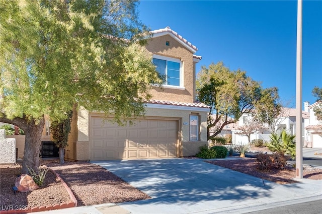 view of front of property with central AC unit and a garage