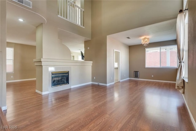 unfurnished living room with hardwood / wood-style flooring