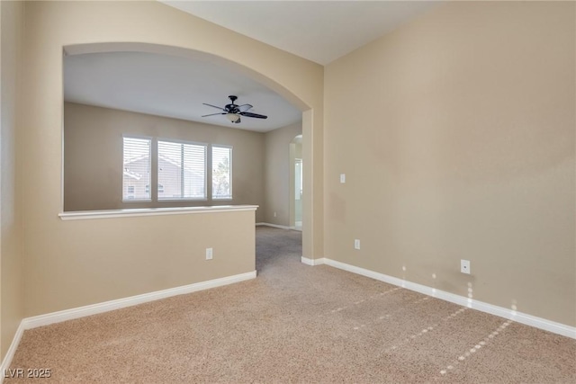 carpeted empty room with ceiling fan