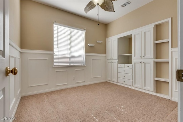 unfurnished bedroom with light carpet and ceiling fan