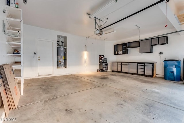 garage featuring a garage door opener and gas water heater