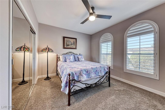 carpeted bedroom featuring ceiling fan and a closet