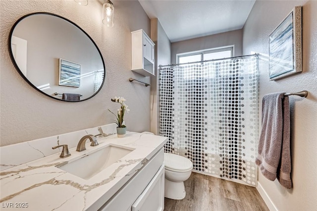 bathroom with vanity, toilet, hardwood / wood-style floors, and a shower with shower curtain