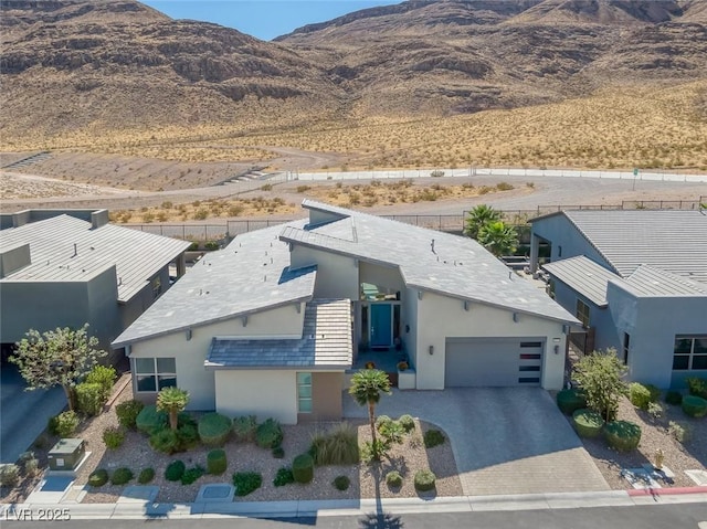 birds eye view of property with a mountain view