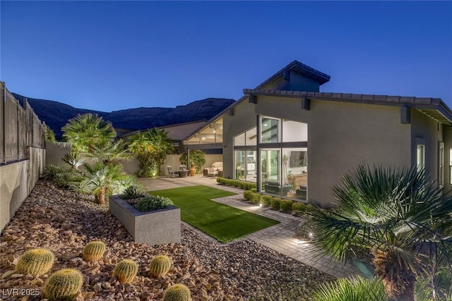 view of yard with a mountain view and a patio